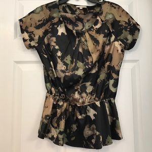 Pleione beige, gold and black peplum shiny top.